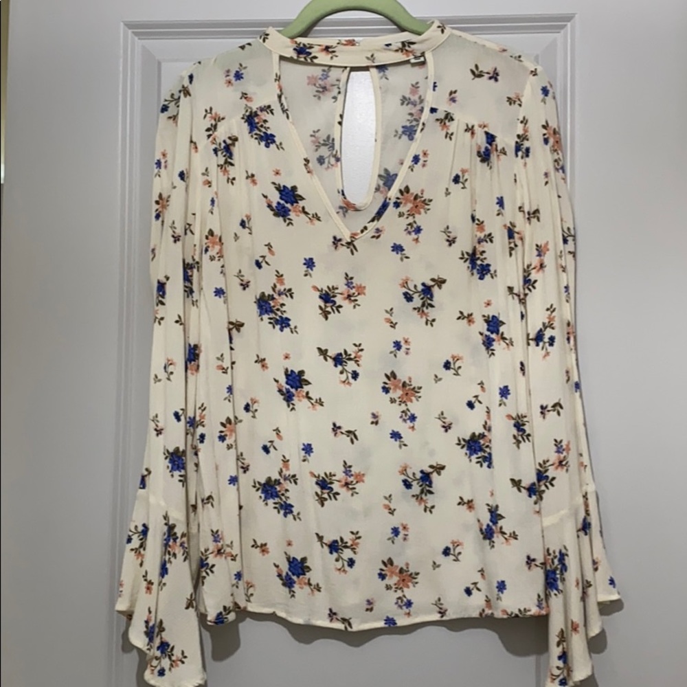 Bell long sleeve blouse with flowers on it